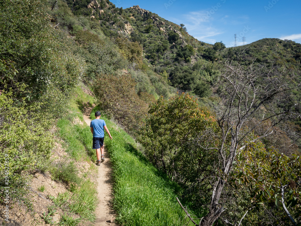 Boy hiking on Jesusita Trail, Santa Barbara, California, USA