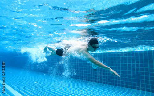 Underwater angle picture Men exercise Freestyle Swimming,