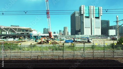Japan Railway train window. View of the station under construction