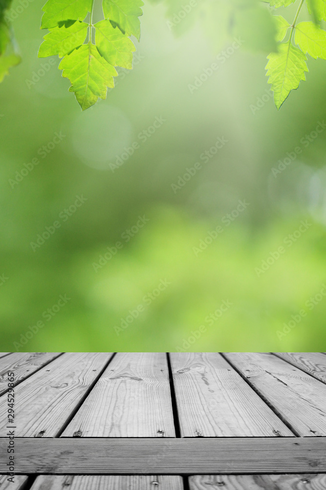 Wooden table and blurred green leaf nature in garden background. Wooden table and blurred green leaf nature in garden background.