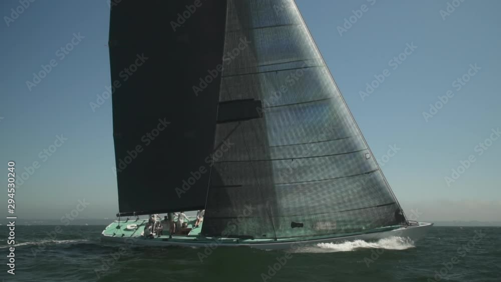 A slow motion shot of a massive sailboat racing along the water in Newport, Rhode Island. Shot in 120fps HD. A slow motion shot of a massive sailboat racing along the water in Newport, Rhode Island. Shot in 120fps HD.
