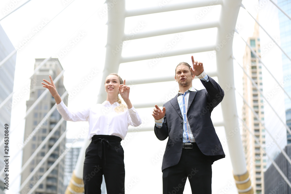 business people discussing on work against walk bridge business people discussing on work against walk bridge