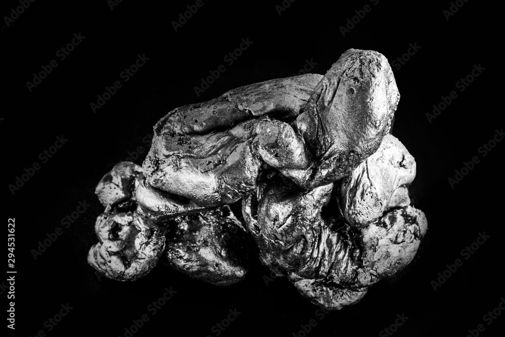 natural platinum nugget isolated on black background natural platinum nugget isolated on black background