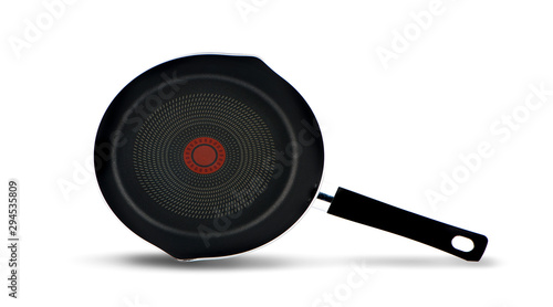 black fry pan over white background