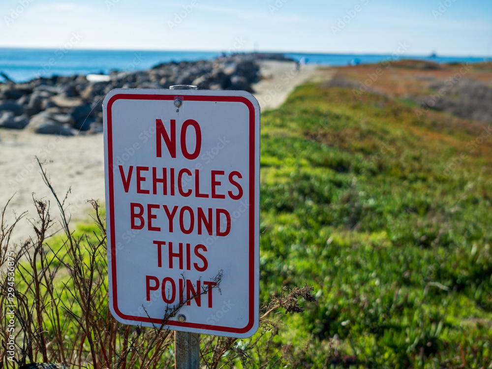 No vehicles beyond this point protecting a beach and sand nature pathway No vehicles beyond this point protecting a beach and sand nature pathway