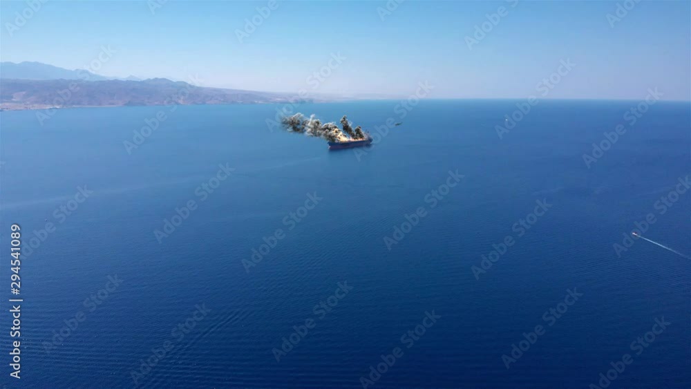 Large Ship under attack in Persian gulf sea With fire Smoke And Helicopter Aerial Illstration Video Illustration using real aerial footage with visual effect elements of Large Cargo ship burning with Large Ship under attack in Persian gulf sea With fire Smoke And Helicopter Aerial Illstration Video Illustration using real aerial footage with visual effect elements of Large Cargo ship burning with