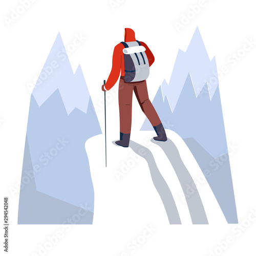 Backpacker hiking snowy mountains with trekking pole