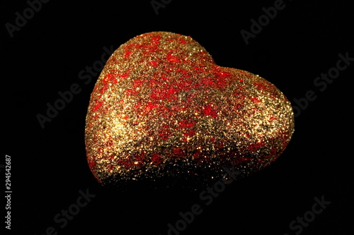 beautiful photo with red shiny heart on black background