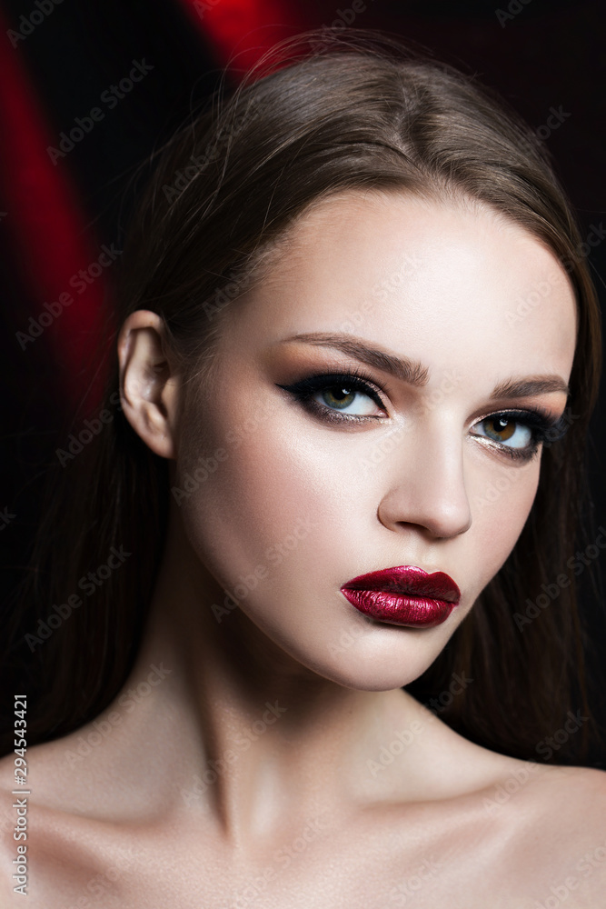 Beauty portrait of a beautiful brunette on black background Beauty portrait of a beautiful brunette on black background