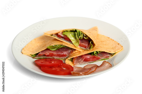 Wrap tortilla sandwich with ham, tomato, lettuce.