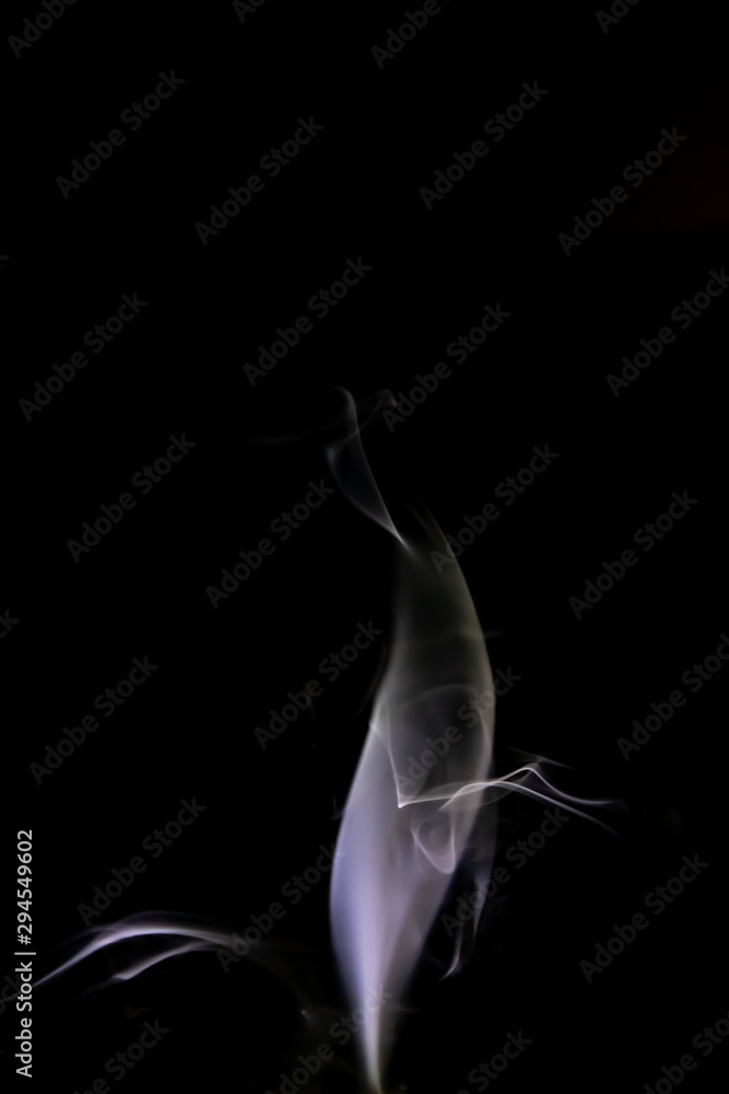 Smoke trail from candles lit from the side Smoke trail from candles lit from the side