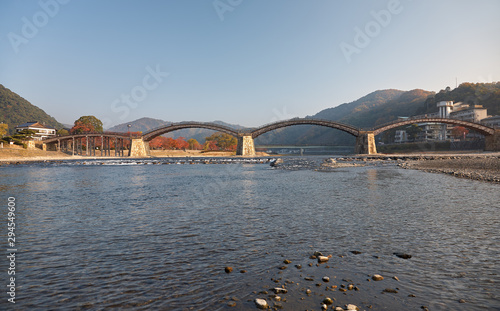 The famous historical wooden arch Kintai Bridge in Iwakuni city in the fall, Japan photo