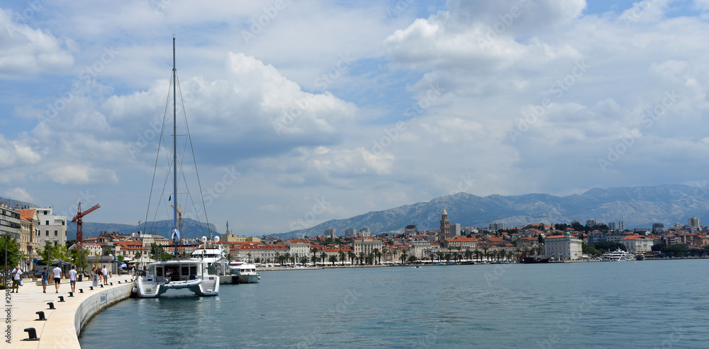  Split seafront and marina with yacht. Croatia.