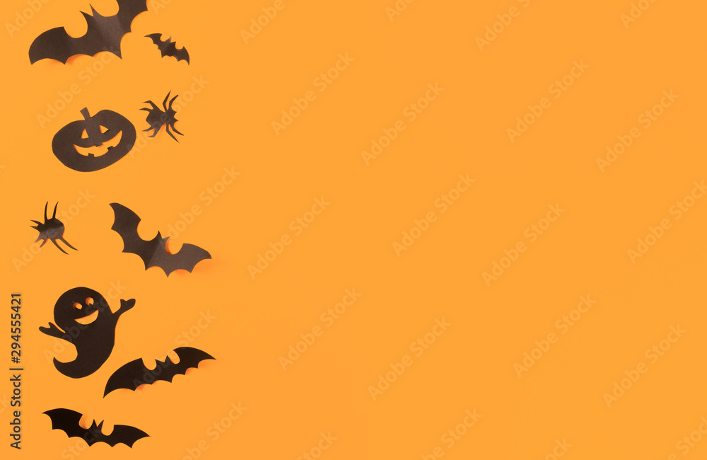 Halloween paper decorations on orange background. Halloween concept. Flat lay, top view, copy space - Image фотография Stock