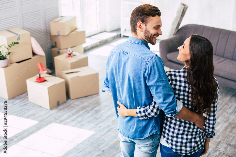 And let everything wait. Despite having lots of work to do related to the new home, a young couple just can't resist cuddling each other. And let everything wait. Despite having lots of work to do related to the new home, a young couple just can't resist cuddling each other.