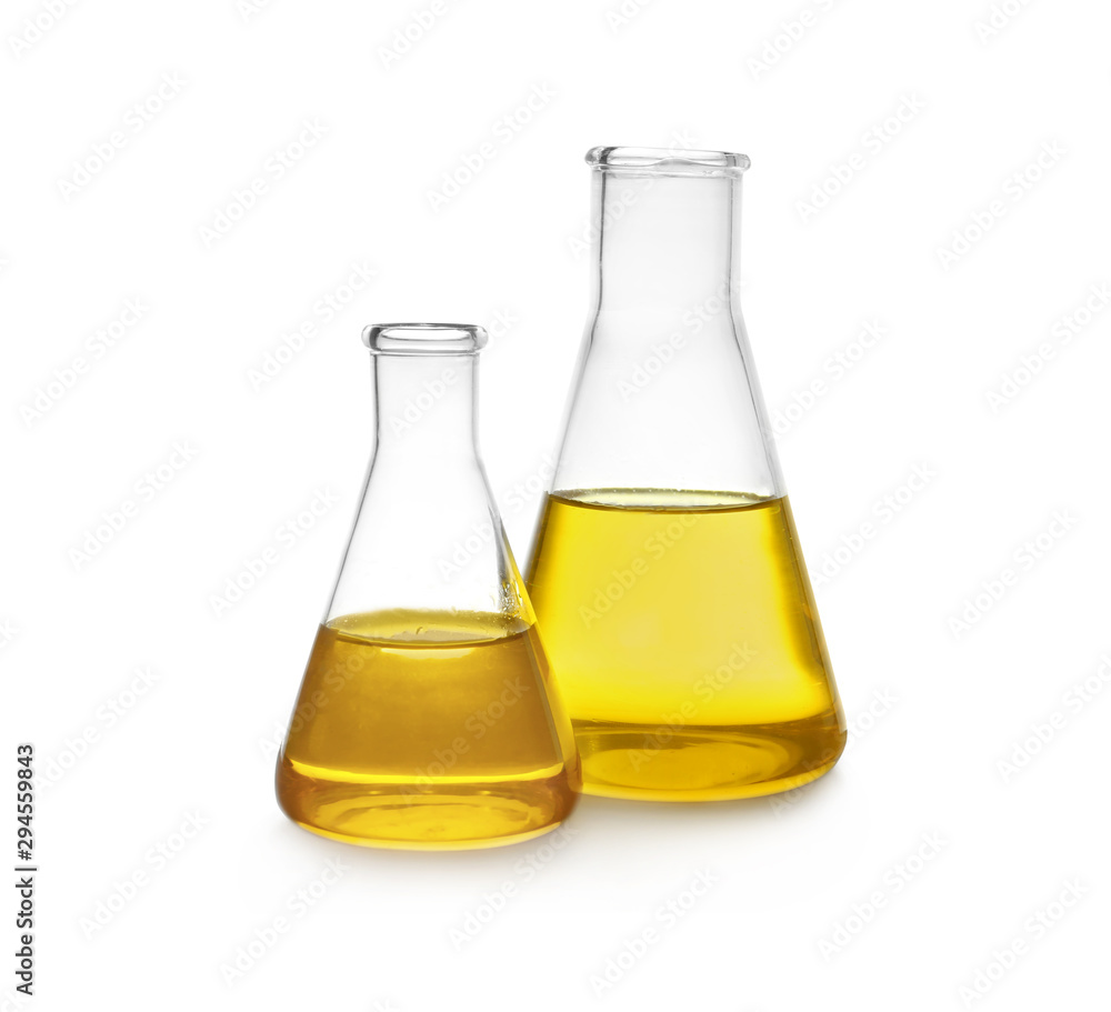Conical flasks with yellow liquid on white background Conical flasks with yellow liquid on white background
