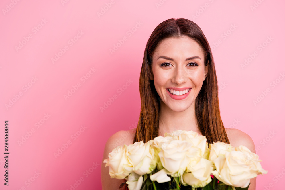 Close-up portrait of her she nice attractive lovely charming cute winsome cheerful cheery brown-haired girl holding in hands white roses isolated over pink pastel color background Close-up portrait of her she nice attractive lovely charming cute winsome cheerful cheery brown-haired girl holding in hands white roses isolated over pink pastel color background