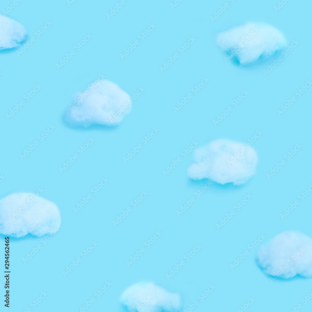 Clouds handmade on blue background. Flat lay. Weather minimal concept. Clouds handmade on blue background. Flat lay. Weather minimal concept.