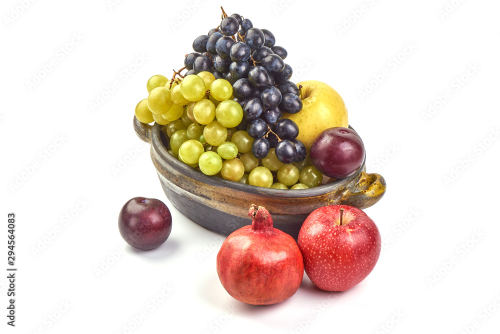 Sweet fresh juicy fruits, apples, grapes, grapefruit, plums, isolated on white background Sweet fresh juicy fruits, apples, grapes, grapefruit, plums, isolated on white background
