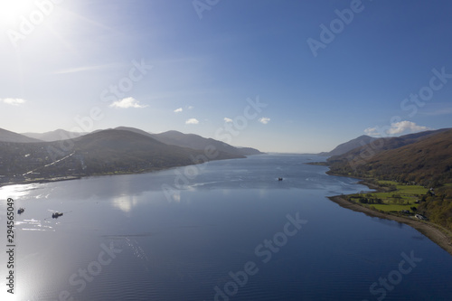 Scottish Loch aerial view in the UK with boats and bright sunshine