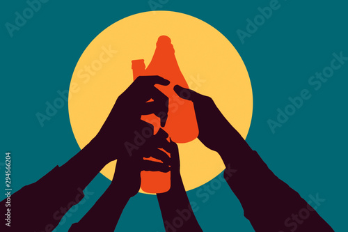 Fototapeta hands holding a bottle of beers and toasting up against a big yellow sun