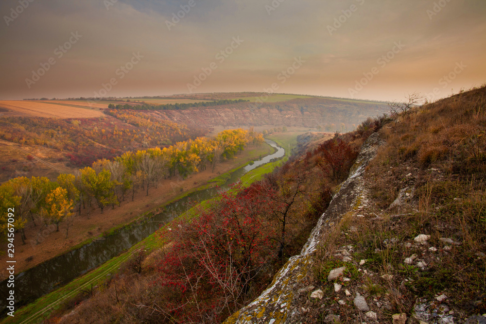 Sunrise over a misty small river