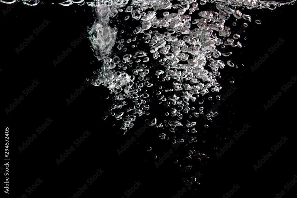 water splash with bubbles of air, isolated on a black background. water splash with bubbles of air, isolated on a black background.