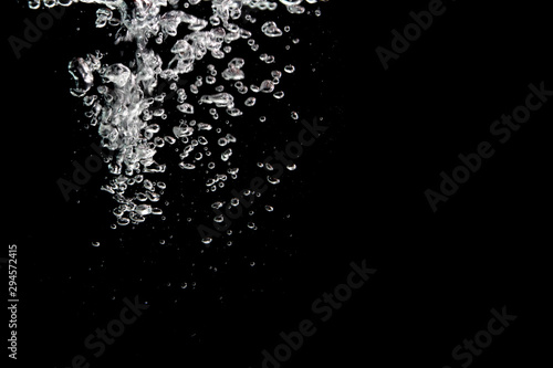 water splash with bubbles of air  isolated on a black background.
