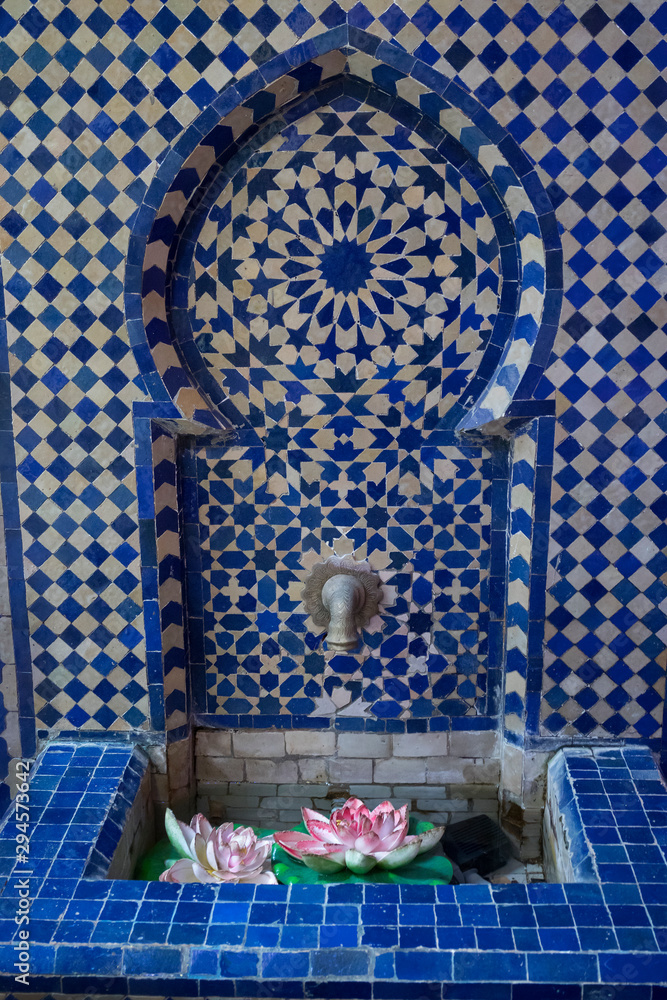 Fototapeta Beautiful water fountain decorated with moroccan tiles