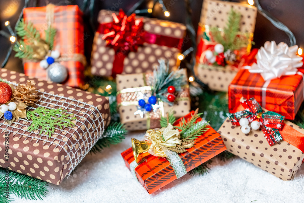Christmas presents with branches Christmas tree on a snow. Christmas gifts on bokeh background Christmas presents with branches Christmas tree on a snow. Christmas gifts on bokeh background