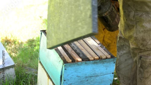 Beekeepers with Beehive, honey and bees