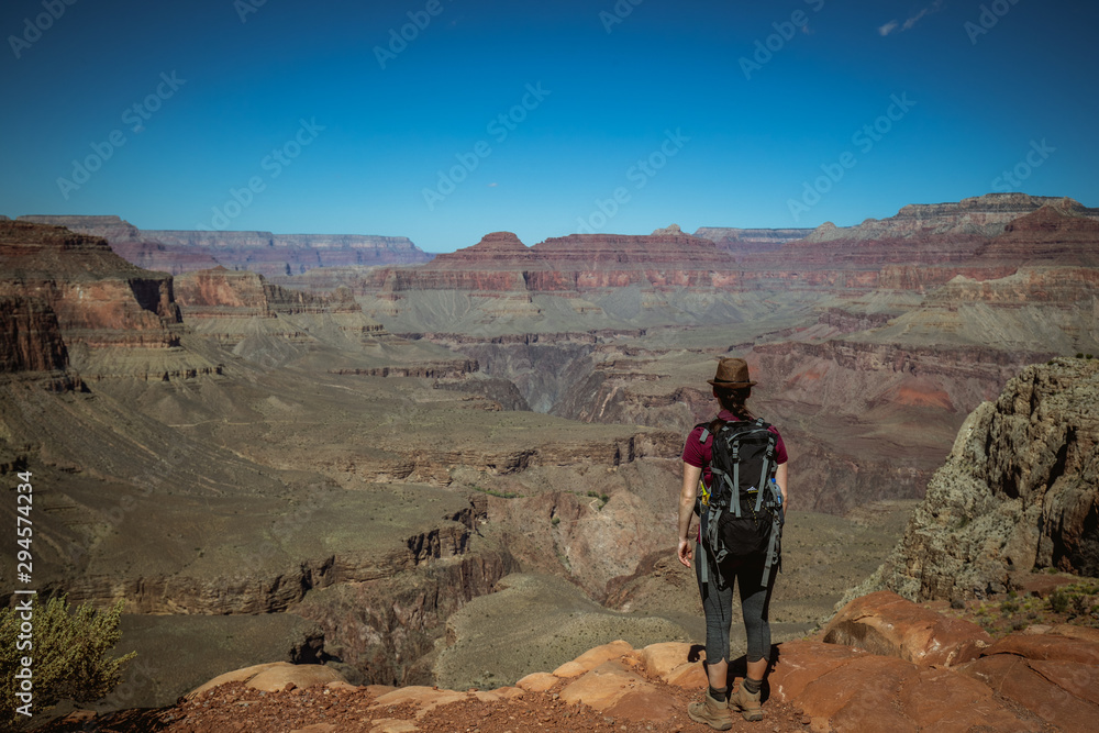Girl enjoying the view from a viewpoint on south kaibab trail  after a hike in the grand canyon national park arizona