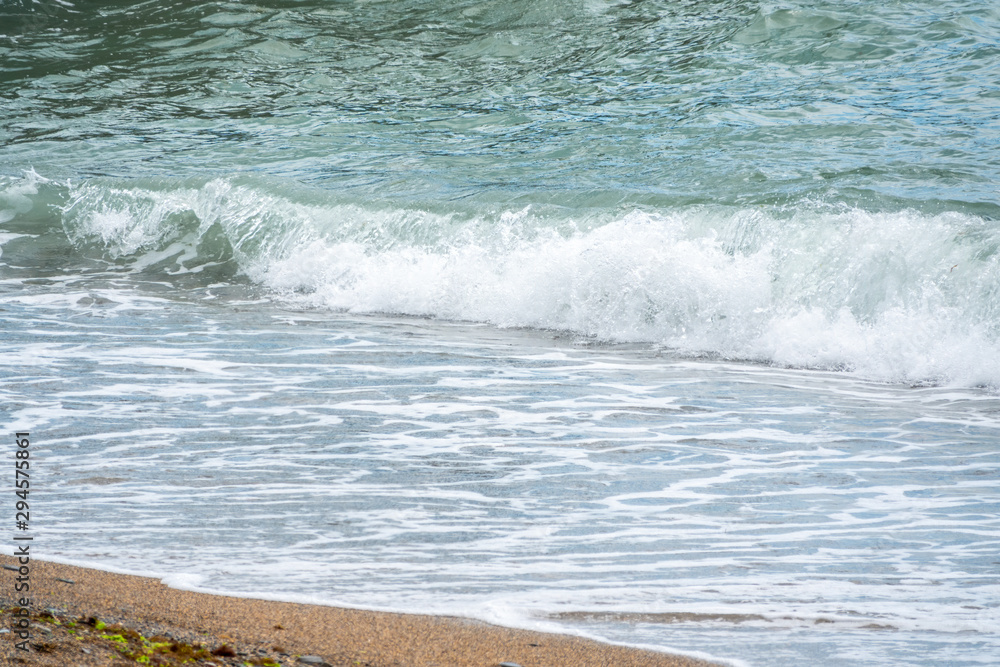 Soft wave of the sea on the sandy beach Soft wave of the sea on the sandy beach