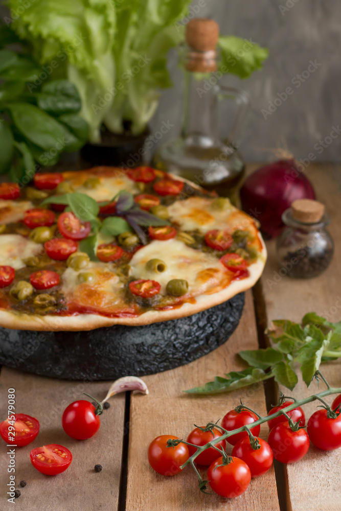 Hot pizza with tomatoes, mozzarella and basil