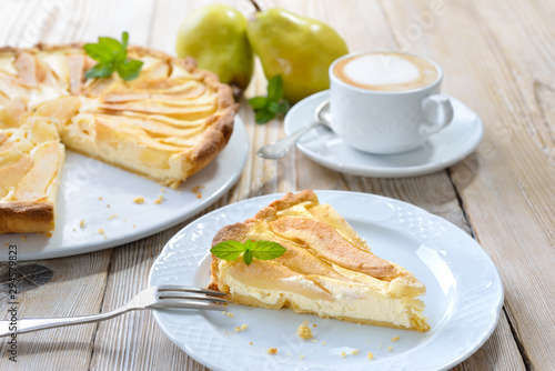Obraz na płótnie Home baked French style dessert pear tart with curd cheese, served with a cup o