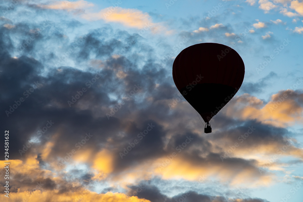 Hot air balloon over blue sky.