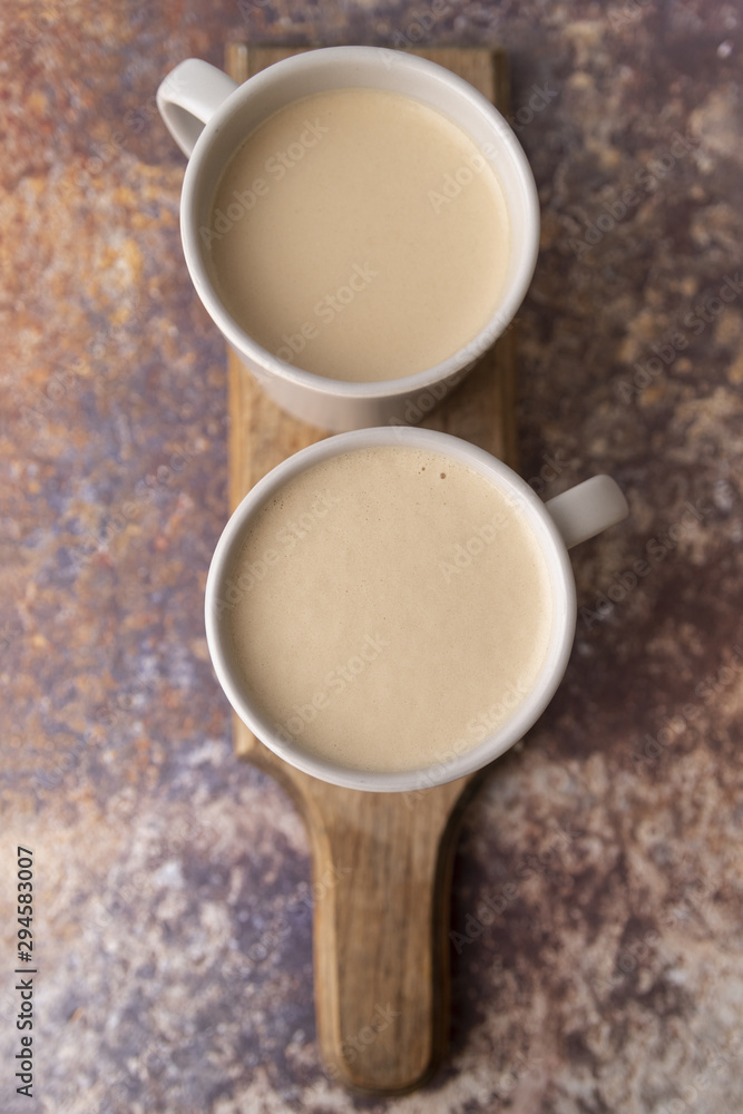 Top view cup of coffee on wooden board Top view cup of coffee on wooden board