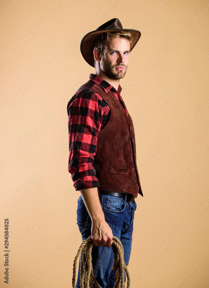 western america. cowboy with lasso rope. Western. Vintage style man. Wild  West retro cowboy. man checkered shirt on ranch. western cowboy portrait.  wild west rodeo. man in hat Photos | Adobe Stock