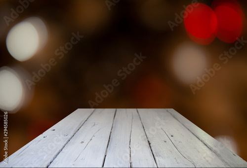 Blurred cafe restaurant club background with wooden table. Place under the text. Empty place. Interer cafe.