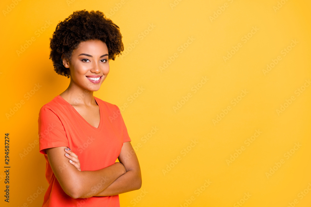 Copyspace photo of trendy charming attractive pretty sweet girlfriend with hands folded smiling toothily wearing t-shirt while isolated over yellow vibrant color background Copyspace photo of trendy charming attractive pretty sweet girlfriend with hands folded smiling toothily wearing t-shirt while isolated over yellow vibrant color background