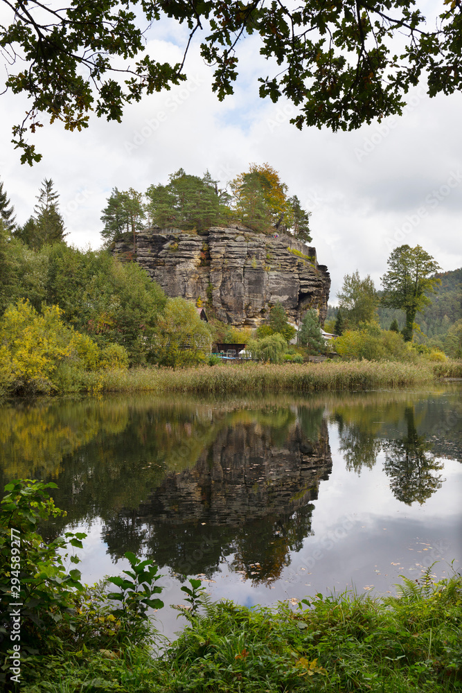 Impregnable medieval rock castle Sloup from the 13th century with Castle pond in northern Bohemia, Czech Republic