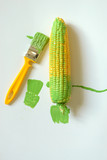 Corn is painted with paintbrush on white background.idea food concept