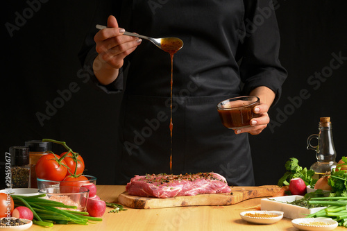 Φωτογραφία Chef cooks pork steak