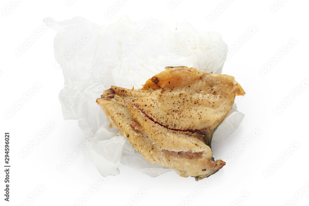 Fried fish in paper, food over white background Fried fish in paper, food over white background