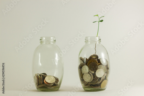 saving money concept of collecting coins (money thai bath in glass bottles) photo