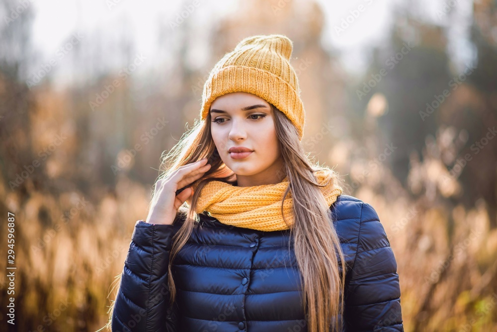 autumn girl in yellow hat and scarf autumn girl in yellow hat and scarf