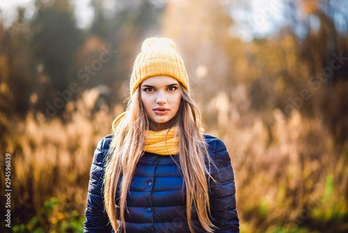 autumn girl in yellow hat and scarf