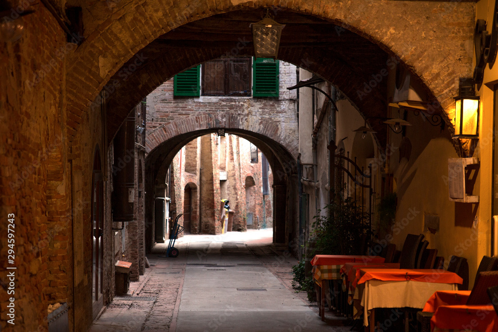 Small alley with arches in the center of Montepulciano Small alley with arches in the center of Montepulciano
