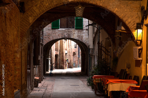 Small alley with arches in the center of Montepulciano
