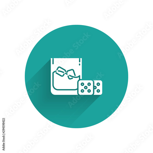 White Game dice and glass of whiskey with ice cubes icon isolated with long shadow. Casino gambling. Green circle button. Vector Illustration